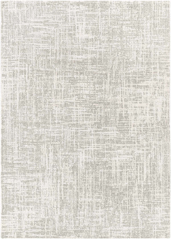 Close-up of the Cowbridge Area Rug, showcasing its charcoal, cream, and light gray geometric pattern and soft texture. Design-Rectangle-5373