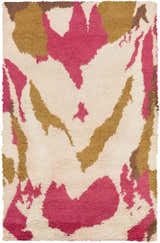 Close-up of Crenshaw Carpet: a hand-woven shag rug with dark brown, light pink, and mustard abstract shapes on a cream base. Design-Rectangle-58