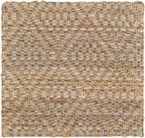Close-up of the hand woven Buwoi Tan Jute Rug. Features natural jute, tan, and subtle black accents. Contemporary style. Swatch