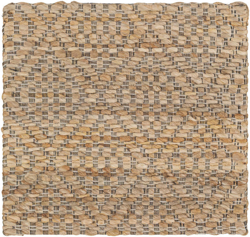 Close-up of the hand woven Buwoi Tan Jute Rug. Features natural jute, tan, and subtle black accents. Contemporary style. Swatch