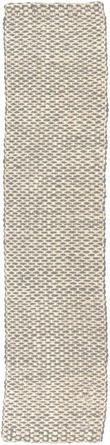 Close-up of the Carrier Clearance Jute Carpet. Hand-woven texture in charcoal, ivory, and natural jute tones. Design-Runner-23