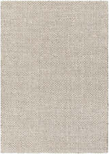 Close-up of the hand-woven Carrier Clearance Jute Carpet in charcoal, ivory, and natural jute. Farmhouse style rug. Design-Rectangle-811