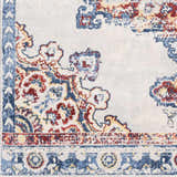 Close up of the Carron Area Rug showing its blue, red, and yellow traditional floral pattern. Swatch