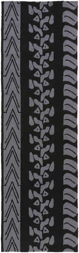 Close-up of the hand-hooked Cressona Area Rug. Black rug with gray contemporary arrow, shape, and wave patterns. Design-Runner-268