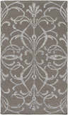 Close-up of the Cottekill Area Rug. Brown rug with an off-white, ornate, hand-woven pattern. Contemporary style. Design-Rectangle-576