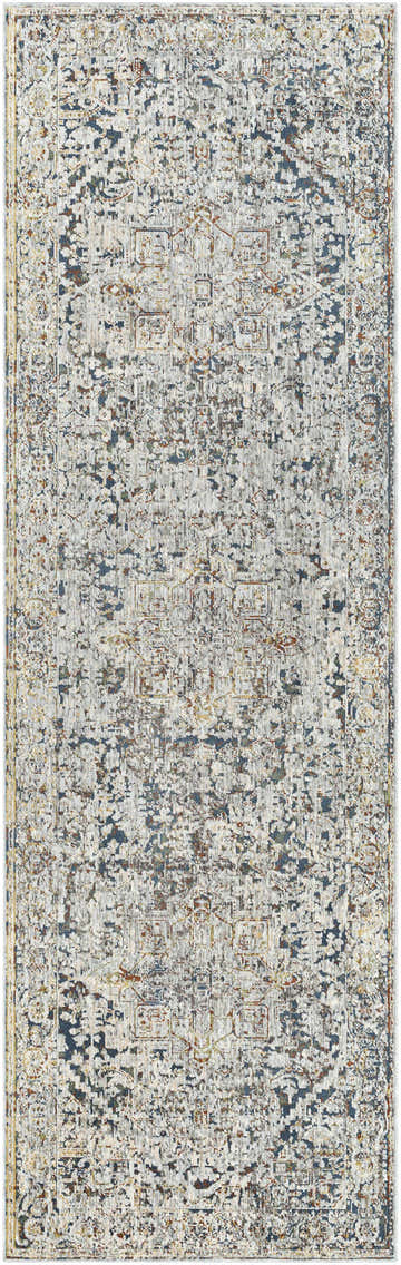 Close-up of the Cuckfield Textured Luxury Rug. Features a vintage, distressed pattern in blue, gray, ivory, and sage. Design-Runner-3310