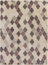 Close-up of the Cuero Area Rug showcasing its quatrefoil pattern in charcoal, light brown, and taupe hues. Design-Rectangle-811