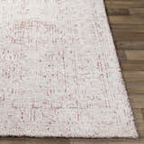Close-up of the Cunderdin Carpet. Mauve and white hand-knotted viscose rug with a traditional geometric pattern. Front