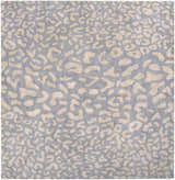 Close-up of the Curwensville Leopard Print Area Rug, featuring a taupe animal pattern on a slate blue wool background. Design-Square-8