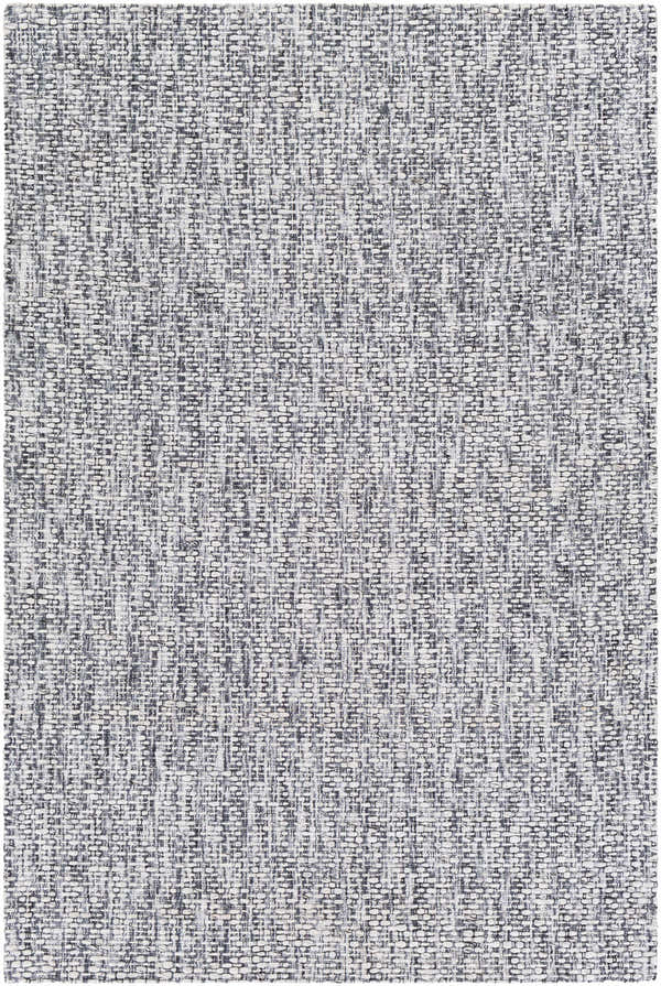 Close-up of textured Cushendall Premium Rug. Hand-loomed weave in dark blue, off white, pale blue, and teal polyester. Design-Rectangle-576
