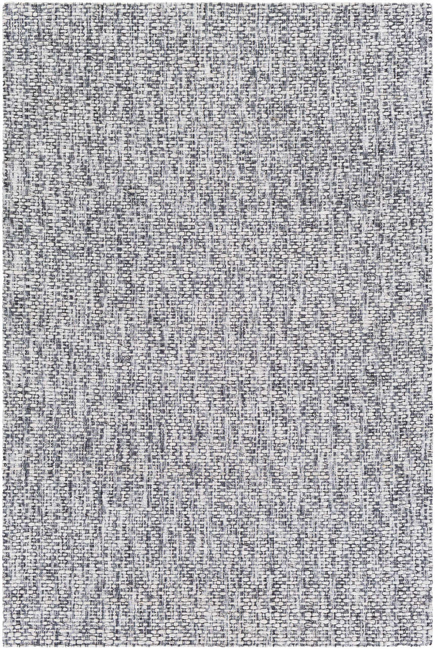 Close-up of textured Cushendall Premium Rug. Hand-loomed weave in dark blue, off white, pale blue, and teal polyester. Design-Rectangle-576