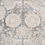 Close-up of the Cwm Area Rug, a contemporary rug in charcoal, light gray, medium gray, and off-white floral pattern. Swatch
