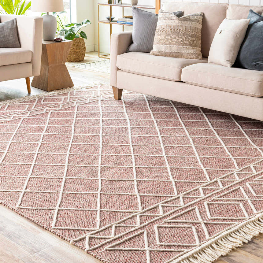 Living room scene with a Dacudao Area Rug. Burgundy rug with a cream geometric pattern under a beige sofa. Roomscene-Rectangle
