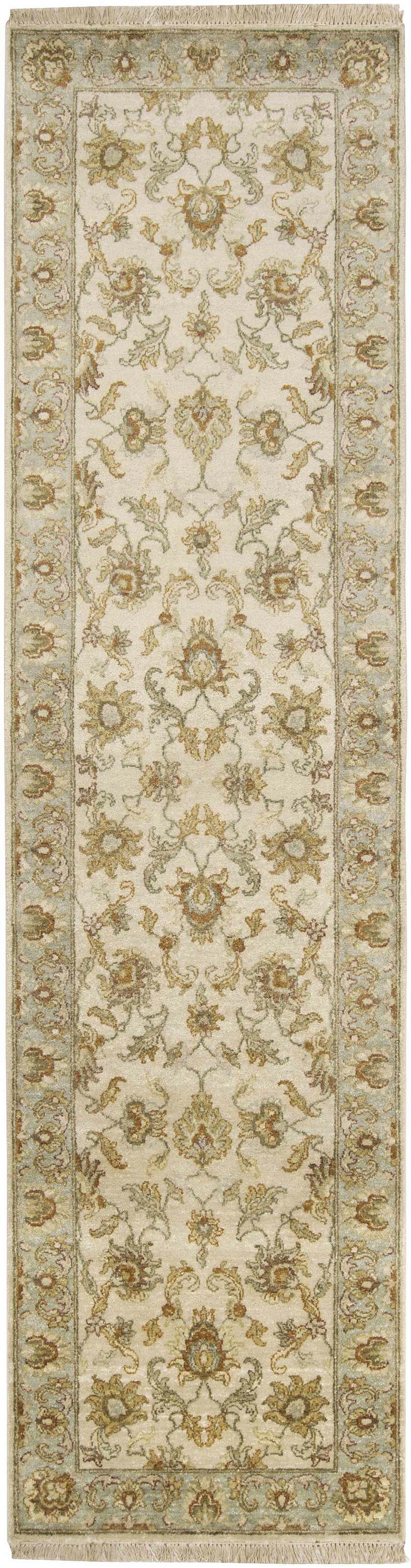 Close-up of the hand-knotted Dahlonega Area Carpet. Beige wool rug with traditional floral pattern in brown, sage, and light gray. Design-Runner-2610
