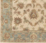 Close-up of the Dahlonega Area Carpet showing its beige field, brown and burgundy floral pattern, and dusty sage border. Swatch