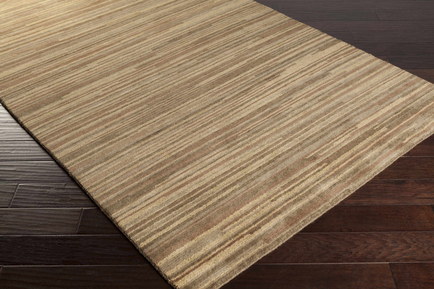 Close-up of the Dawlish Area Rug. Tan, medium brown, and dark red stripes on a hand-knotted wool rug. Corner