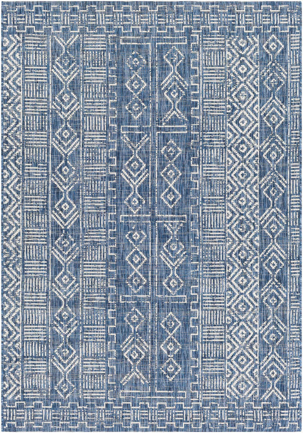 Close-up of the Deeth Area Rug. Bohemian style rug in blue and white with geometric patterns. Design-Rectangle-5376