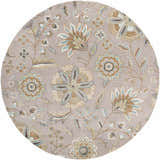 Close-up of the round Denio Area Rug. Floral pattern in brown, dusty sage, light blue and taupe on a light brown wool rug. Design-Round-6