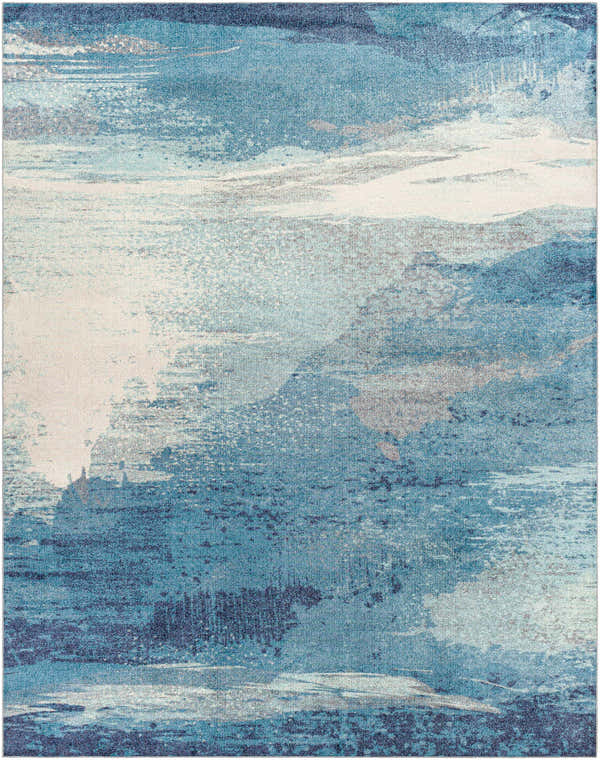Close-up of the Deport Area Rug, featuring a blend of blue, cream, and charcoal colors in a contemporary pattern. Design-Rectangle-7696