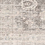 Close-up of the Divisoria Area Rug. Charcoal, cream, and gray traditional rug with a farmhouse style pattern. Swatch
