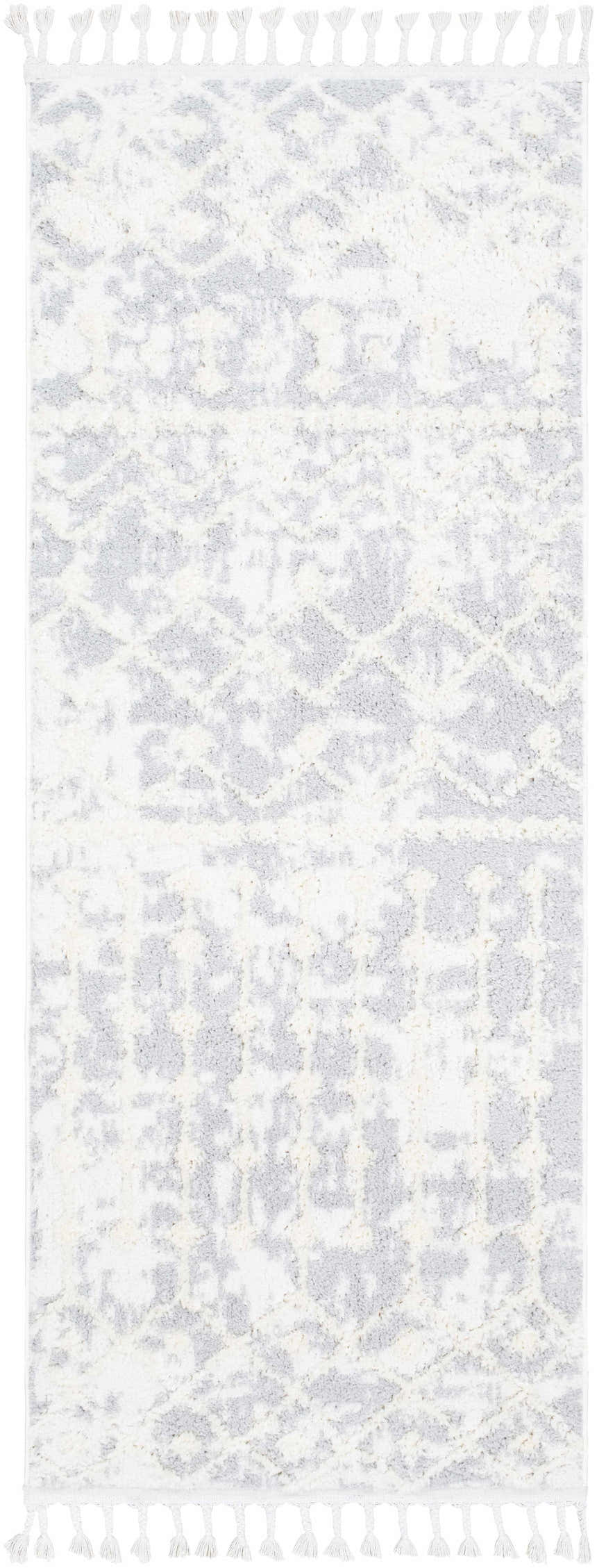 Close-up of the Dolo Area Rug: cream and gray polyester rug with a subtle geometric pattern and decorative white tassels. Design-Runner-2773
