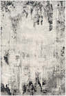 Close-up of the Dumangas Area Rug, a contemporary rug in black, charcoal, cream, and gray with an abstract pattern. Design-Rectangle-5373