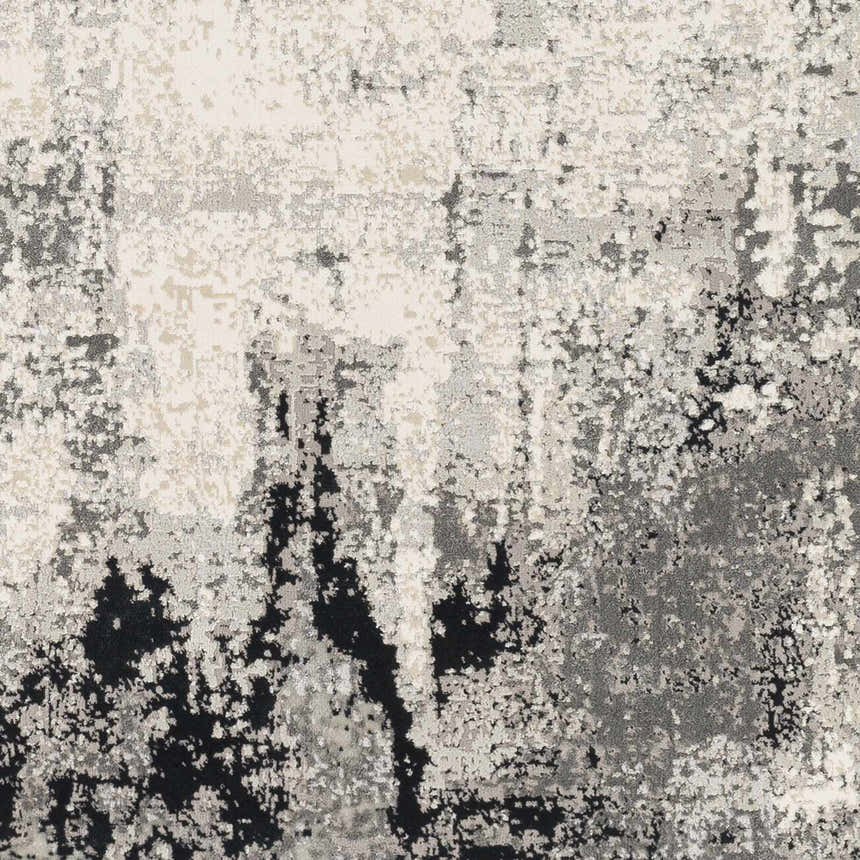 Close-up of the Dumangas Area Rug featuring a contemporary black, charcoal, cream, and gray abstract pattern. Swatch