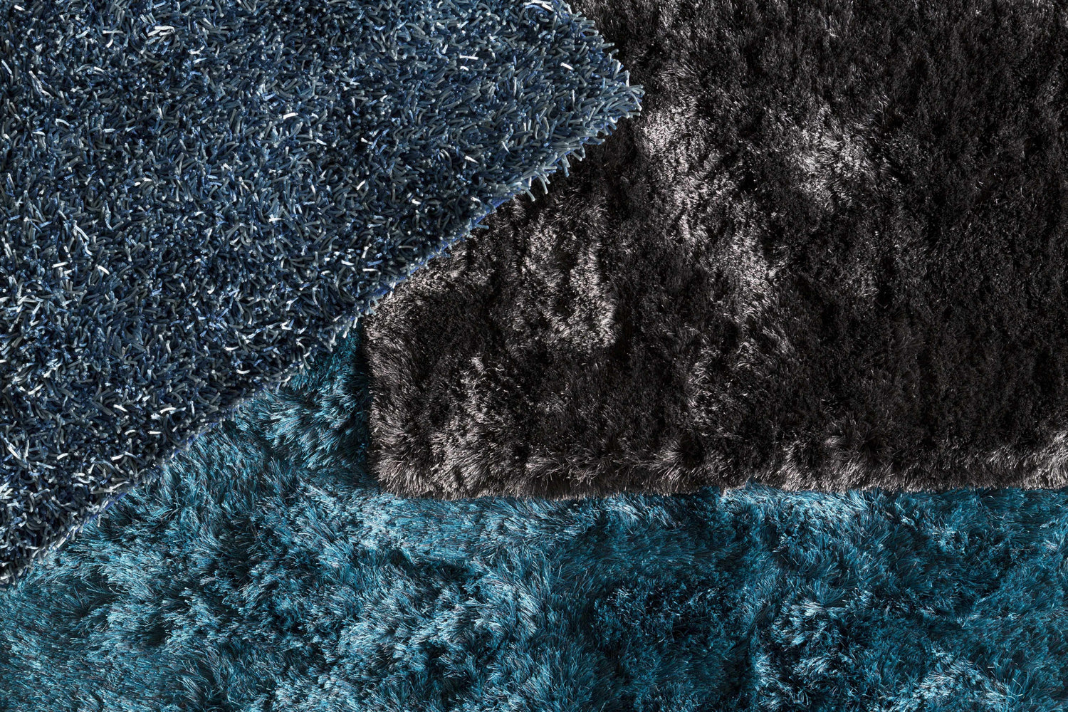 Close-up of the Auxier Area Rug showing its shag texture and ink blue, teal, and black colors. Styleshot