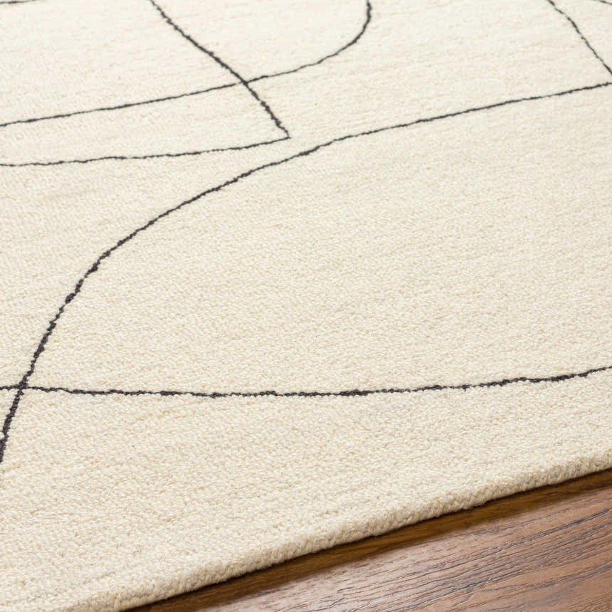 Close-up of Deniz Modern Off-White Wool Rug showing its textured wool and abstract gray line design on a wood floor. Texture