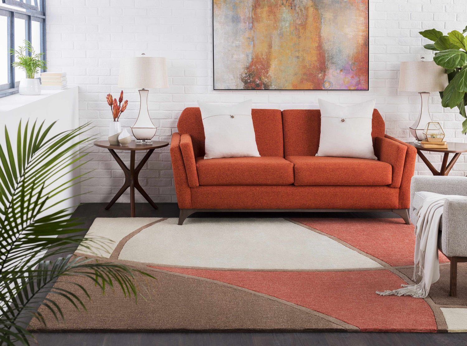 Living room scene with a rust sofa and Docena Carpet in beige, brown, and rust geometric design. Roomscene-Rectangle
