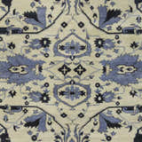 Close-up of Doraville Area Carpet featuring a traditional floral pattern in black, blue, and seafoam on a light background. Swatch