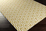 Close-up of the Drewryville Area Carpet. Tan and light gray geometric pattern on a hand woven wool rug. Corner