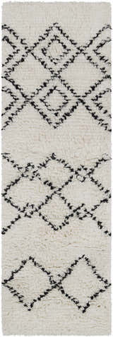 Close-up of the Dukedom Area Rug. Ivory shag rug with black geometric diamond pattern, hand woven wool texture. Design-Runner-268