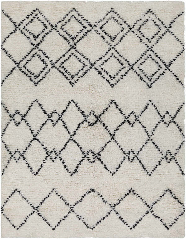 Close up of the hand woven Dukedom Area Rug, a shag rug with black geometric diamonds on ivory wool. Design-Rectangle-576