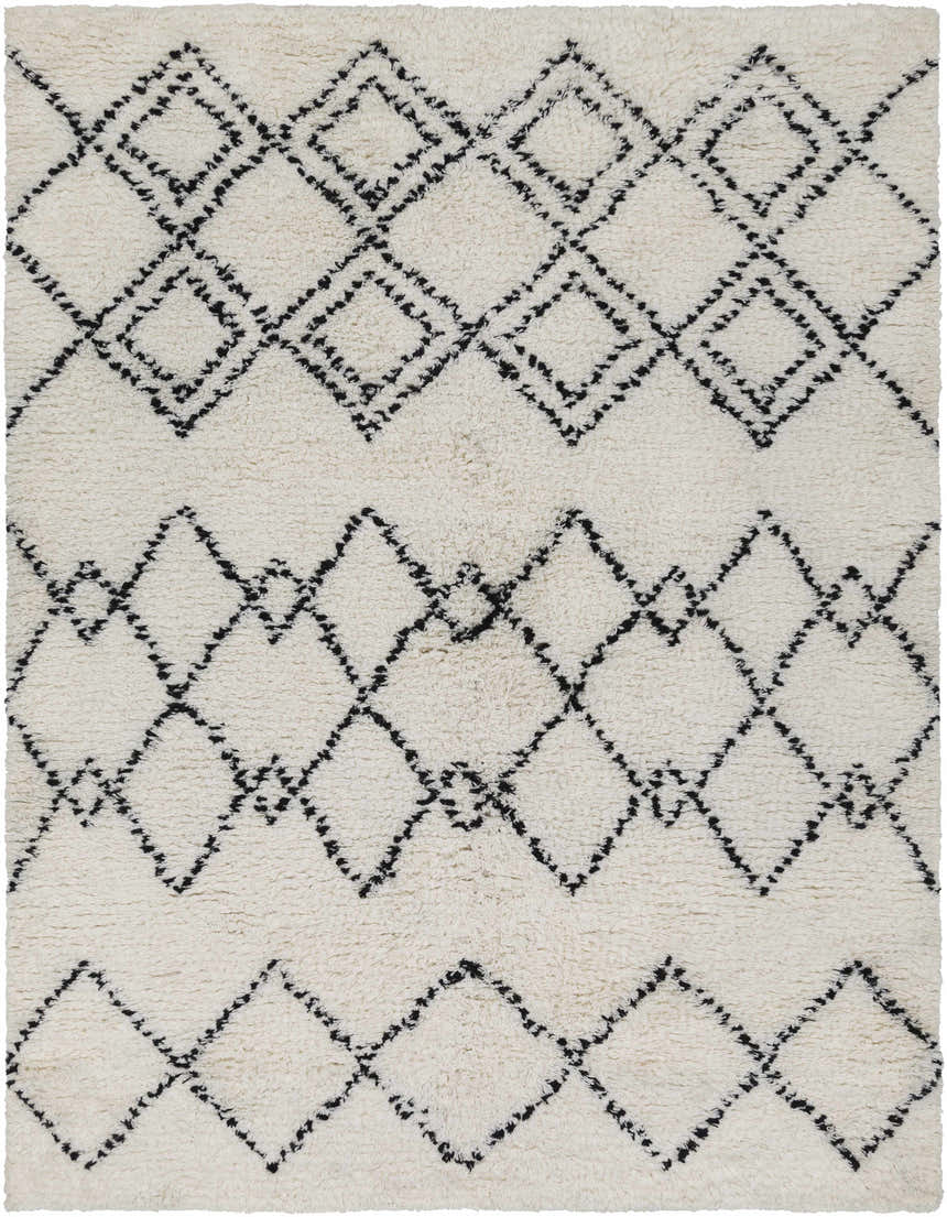 Close up of the hand woven Dukedom Area Rug, a shag rug with black geometric diamonds on ivory wool. Design-Rectangle-576