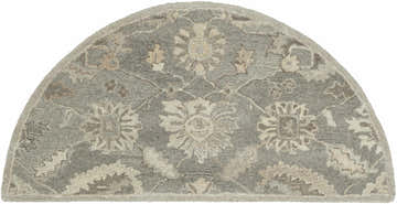 Close-up of a Hearth-shaped Dulles Area Rug. Hand-tufted 100% wool rug in charcoal, beige, brown, and taupe floral pattern. Design-Hearth