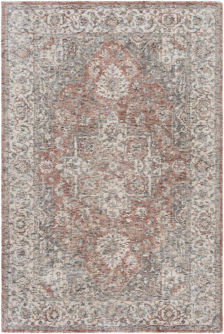 Close-up of the hand-knotted Dunmor Area Rug. Features a traditional Persian design in brick red, charcoal, and cream. Design-Rectangle-576