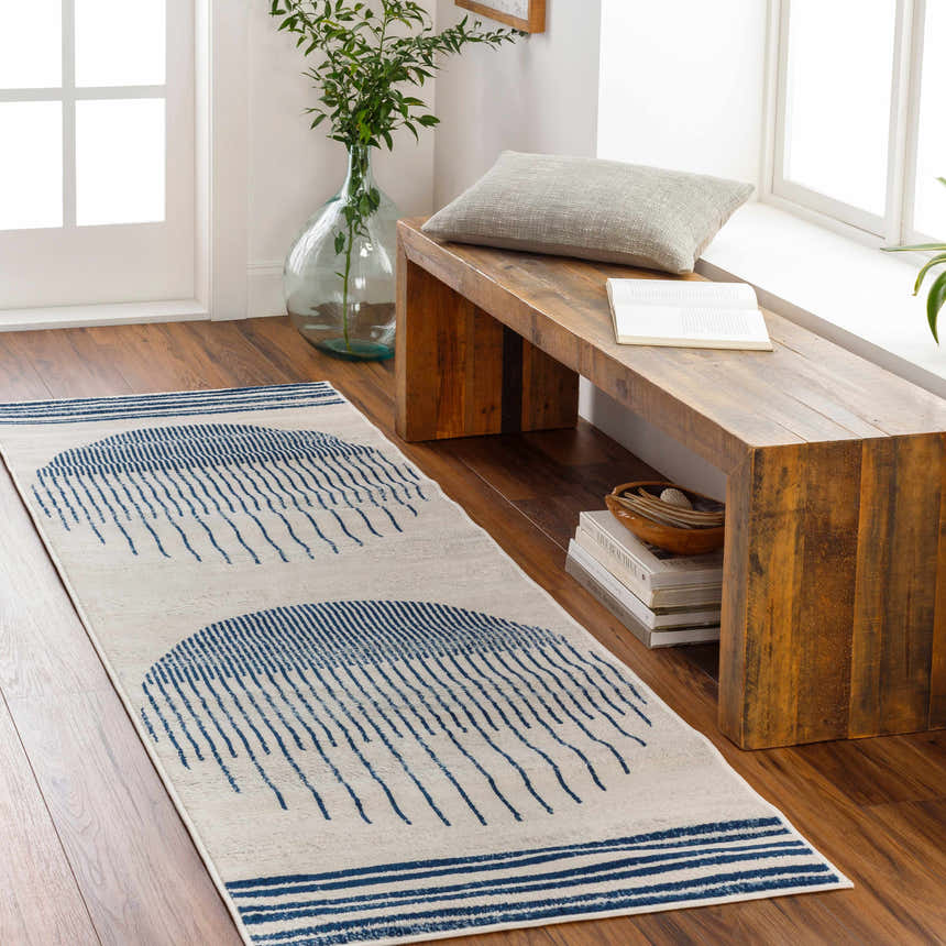 Entryway scene with a Duri Area Rug runner in admiral blue geometric design, wood bench, and natural light. Roomscene-Runner
