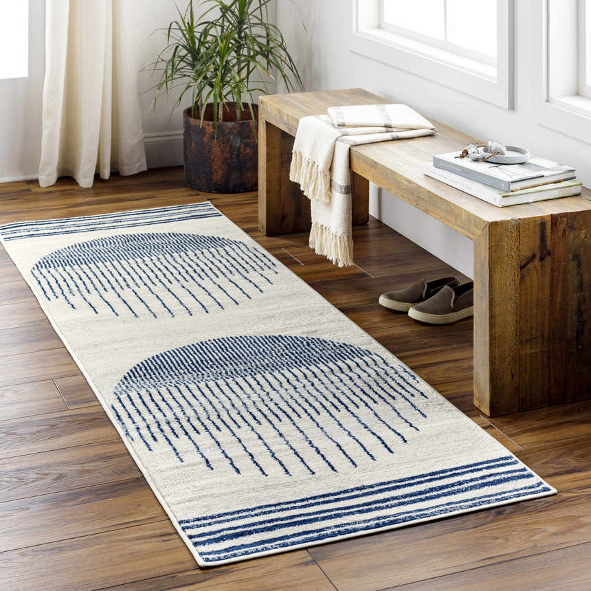 Entryway styled with a Duri Area Rug. The runner rug has a geometric blue pattern on a natural background. Roomscene-Runner