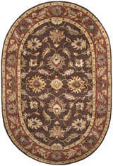 Close-up of the oval Daviston Area Rug. Hand-tufted wool rug in brown, brick red, and beige with an oriental floral pattern. Design-Oval-69