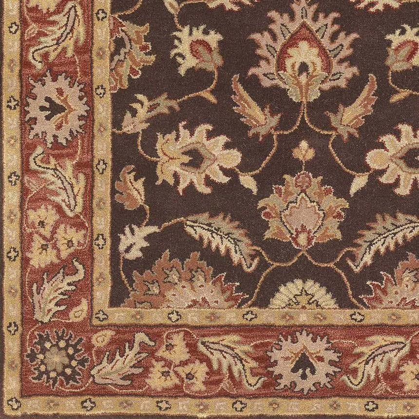 Close up of the wool Daviston Area Rug, featuring a traditional floral pattern in brown, beige, and brick red hues. Swatch