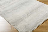 Close-up of the Uzima Gray Area Rug showing its subtle light slate and medium gray contemporary design and soft texture. Corner