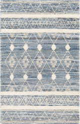 Close-up of Eben Area Carpet: hand-woven cotton rug with a geometric diamond pattern in shades of light blue, navy, and off-white. Design-Rectangle-576