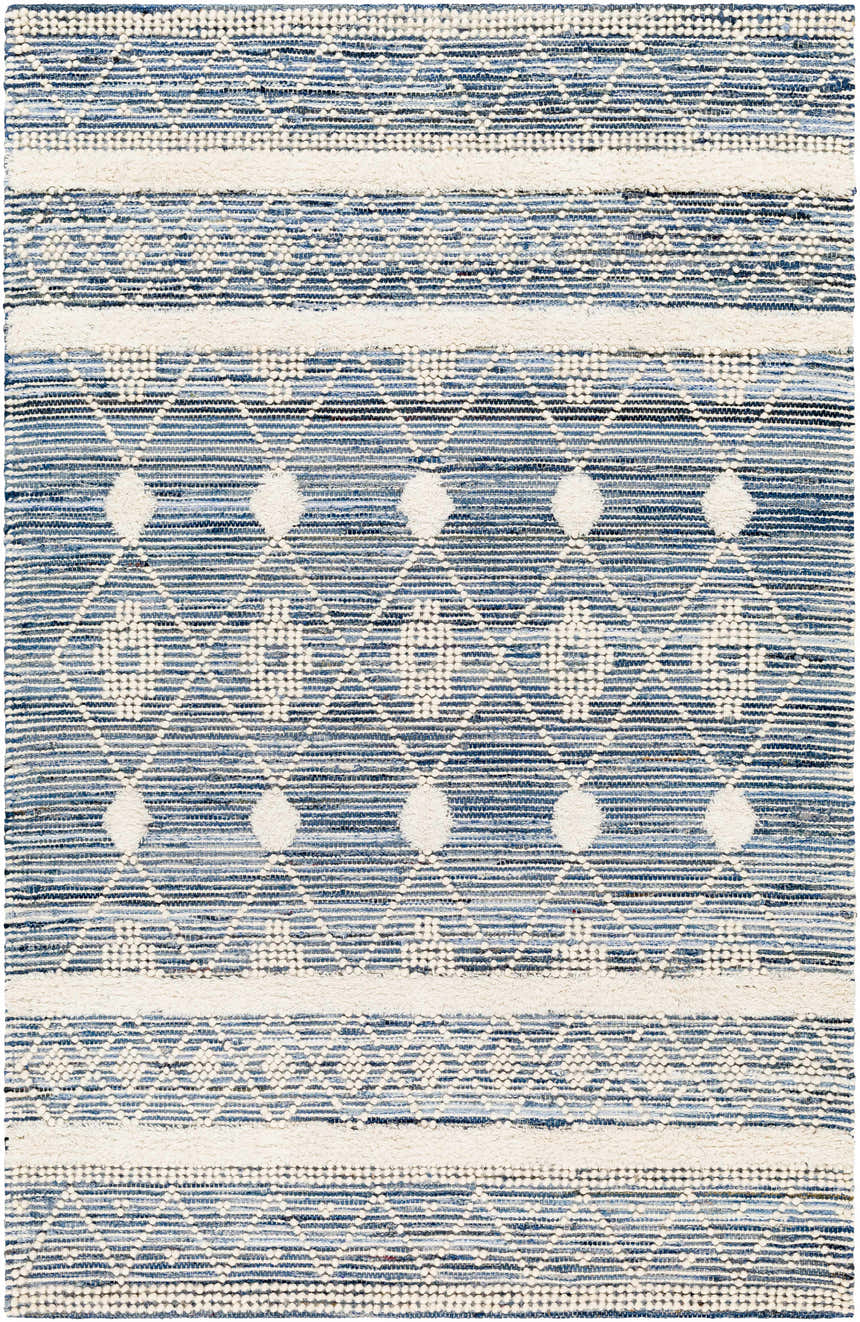 Close-up of Eben Area Carpet: hand-woven cotton rug with a geometric diamond pattern in shades of light blue, navy, and off-white. Design-Rectangle-576
