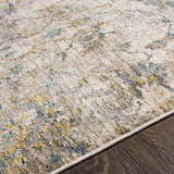 Close-up of the Morinville Teal Floral Rug showing its traditional pattern, teal, tan, and mustard colors, and machine-woven texture. Texture