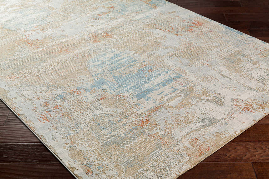 Close-up of the Efren Thick Luxe Area Rug showing its dark beige, dusty sage, and gray contemporary design. Corner
