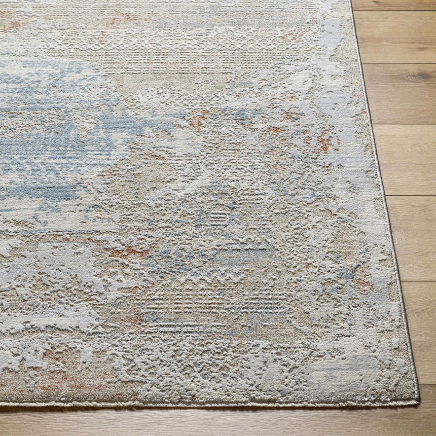 Close-up of the Efren Thick Luxe Area Rug in dark beige, dusty sage, and gray on a light wood floor. Contemporary style. Front