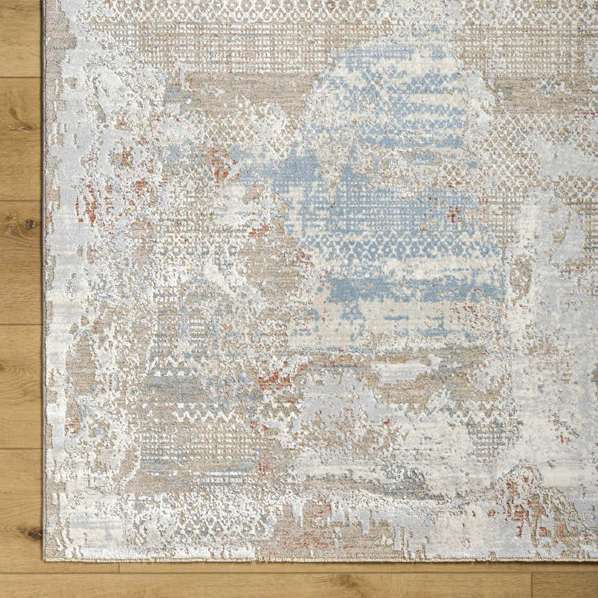 Close-up of the Efren Thick Luxe Area Rug showing its dark beige, dusty sage, and gray contemporary pattern. Corner