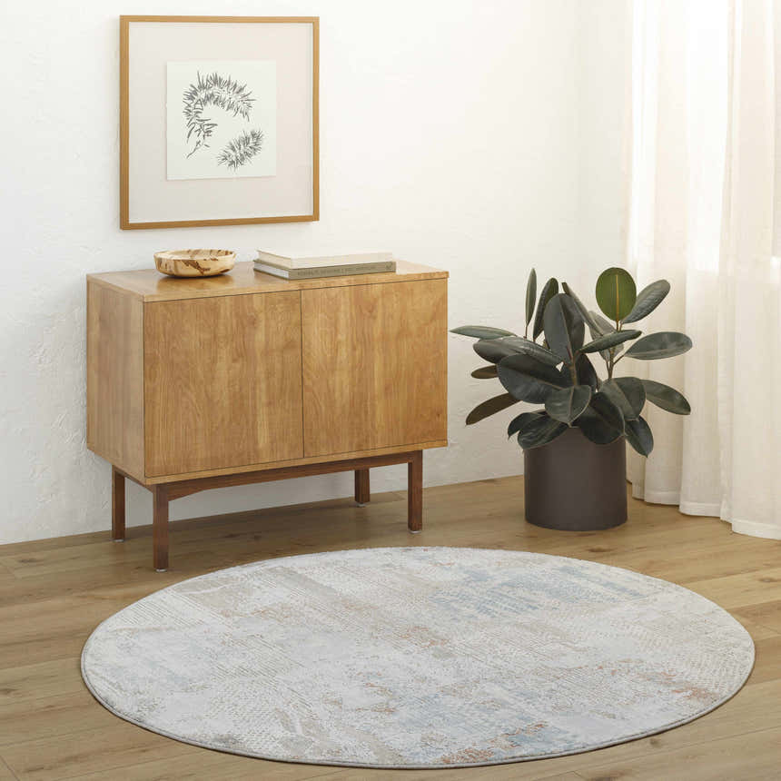 Entryway with wood floors, cabinet, and round Efren Thick Luxe Area Rug in dark beige, dusty sage, and gray. Roomscene-Round