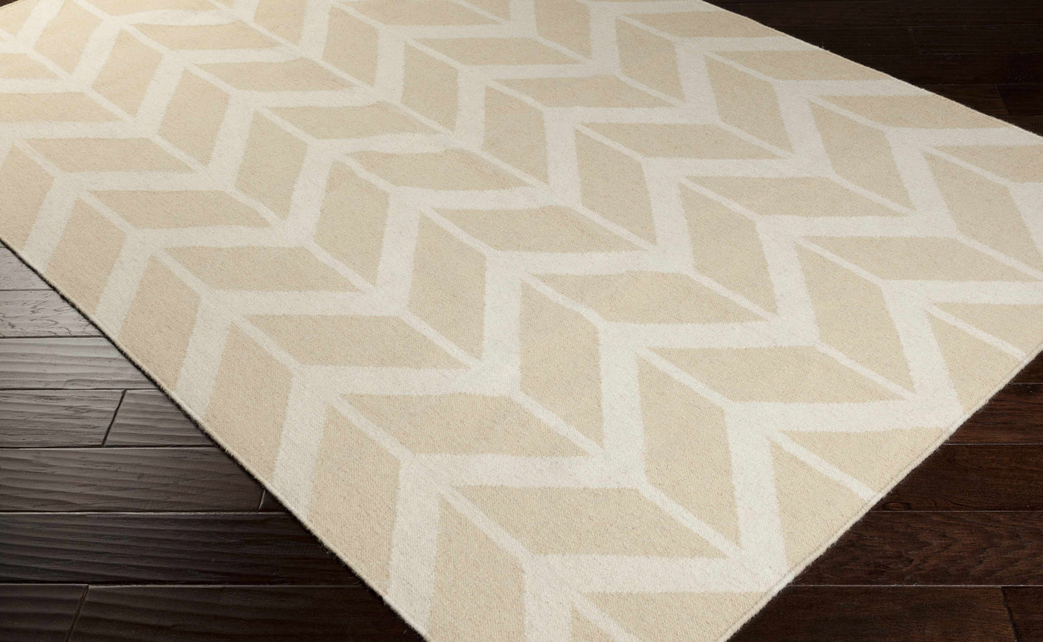 Close-up of the Elamton Area Rug, a hand-woven wool rug with a contemporary geometric pattern in beige and cream. Corner